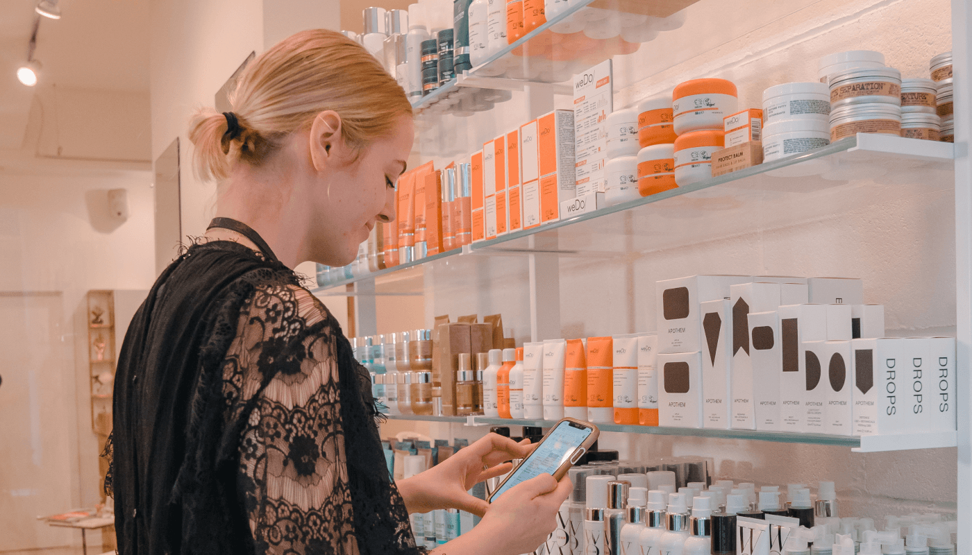 A salong employee is shown here easily scanning the product that she wishes to adjust in her stock take using the Timely Stock App.